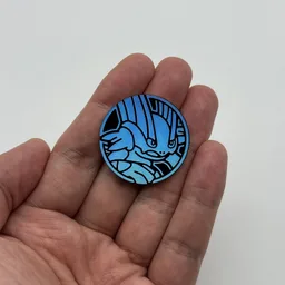 In hand, from Pokémon Coin Fan, full size