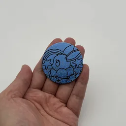In hand, from Pokémon Coin Fan, full size