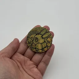 In hand, from Pokémon Coin Fan, full size