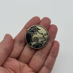 In hand, from Pokémon Coin Fan, full size
