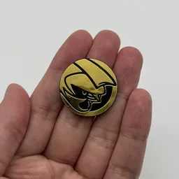 In hand, from Pokémon Coin Fan, full size