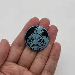 In hand, from Pokémon Coin Fan, full size