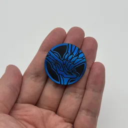 In hand, from Pokémon Coin Fan, full size