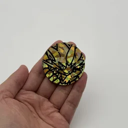 In hand, from Pokémon Coin Fan, full size