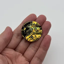 In hand, from Pokémon Coin Fan, full size