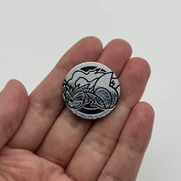 In hand, from Pokémon Coin Fan, full size