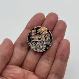 In hand, from Pokémon Coin Fan, full size