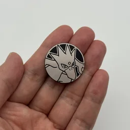 In hand, from Pokémon Coin Fan, full size