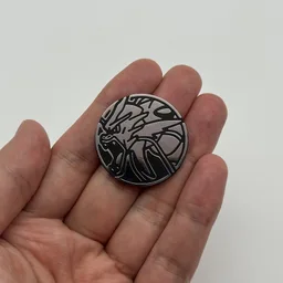 In hand, from Pokémon Coin Fan, full size
