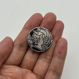 In hand, from Pokémon Coin Fan, full size