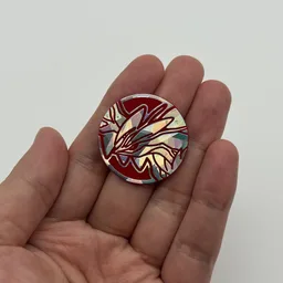 In hand, from Pokémon Coin Fan, full size