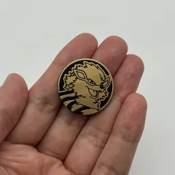 In hand, from Pokémon Coin Fan, full size