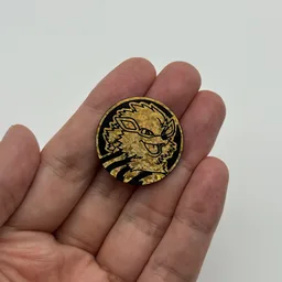 In hand, from Pokémon Coin Fan, full size