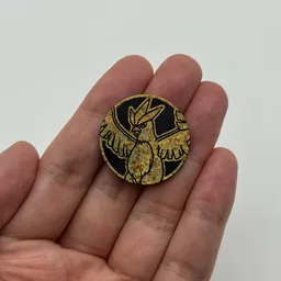 In hand, from Pokémon Coin Fan, full size