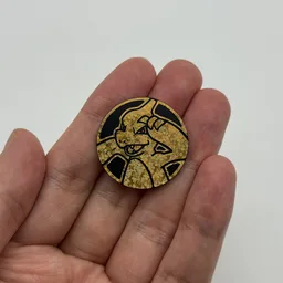 In hand, from Pokémon Coin Fan, full size