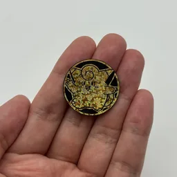 In hand, from Pokémon Coin Fan, full size