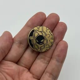 In hand, from Pokémon Coin Fan, full size
