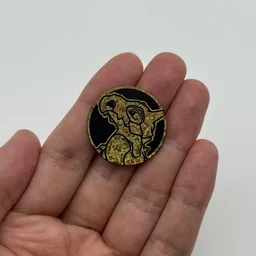 In hand, from Pokémon Coin Fan, full size