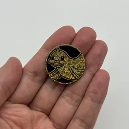 In hand, from Pokémon Coin Fan, full size