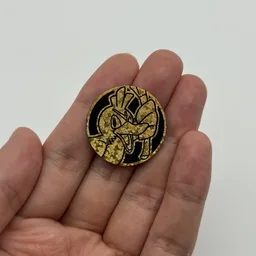 In hand, from Pokémon Coin Fan, full size