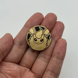 In hand, from Pokémon Coin Fan, full size