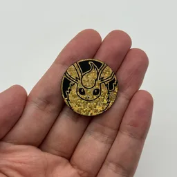 In hand, from Pokémon Coin Fan, full size