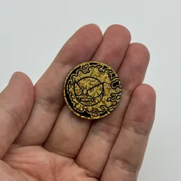 In hand, from Pokémon Coin Fan, full size