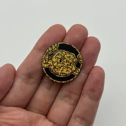 In hand, from Pokémon Coin Fan, full size