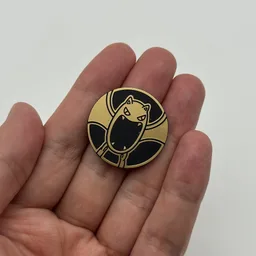 In hand, from Pokémon Coin Fan, full size