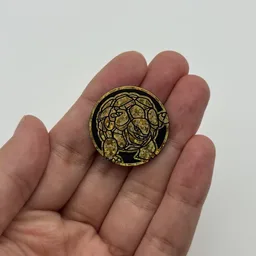 In hand, from Pokémon Coin Fan, full size