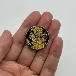 In hand, from Pokémon Coin Fan, full size