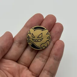 In hand, from Pokémon Coin Fan, full size