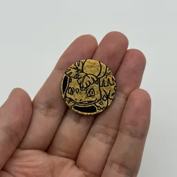 In hand, from Pokémon Coin Fan, full size