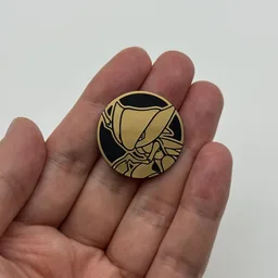 In hand, from Pokémon Coin Fan, full size