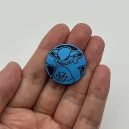 In hand, from Pokémon Coin Fan, full size