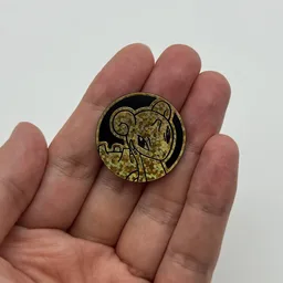 In hand, from Pokémon Coin Fan, full size