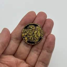 In hand, from Pokémon Coin Fan, full size