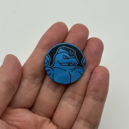 In hand, from Pokémon Coin Fan, full size