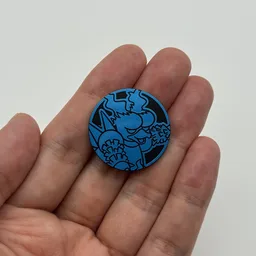 In hand, from Pokémon Coin Fan, full size
