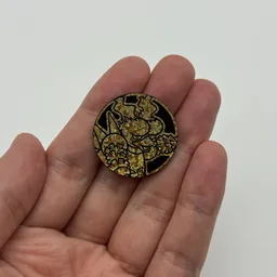 In hand, from Pokémon Coin Fan, full size