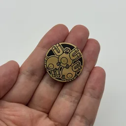 In hand, from Pokémon Coin Fan, full size