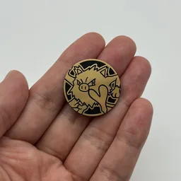 In hand, from Pokémon Coin Fan, full size