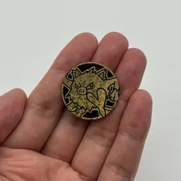 In hand, from Pokémon Coin Fan, full size