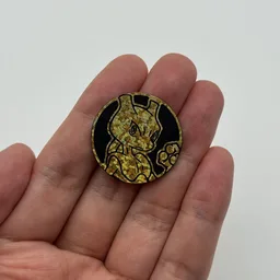 In hand, from Pokémon Coin Fan, full size