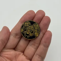 In hand, from Pokémon Coin Fan, full size