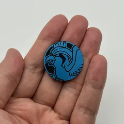 In hand, from Pokémon Coin Fan, full size