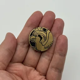 In hand, from Pokémon Coin Fan, full size