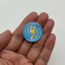 In hand, from Pokémon Coin Fan, full size