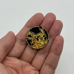 In hand, from Pokémon Coin Fan, full size