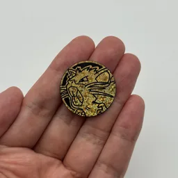 In hand, from Pokémon Coin Fan, full size
